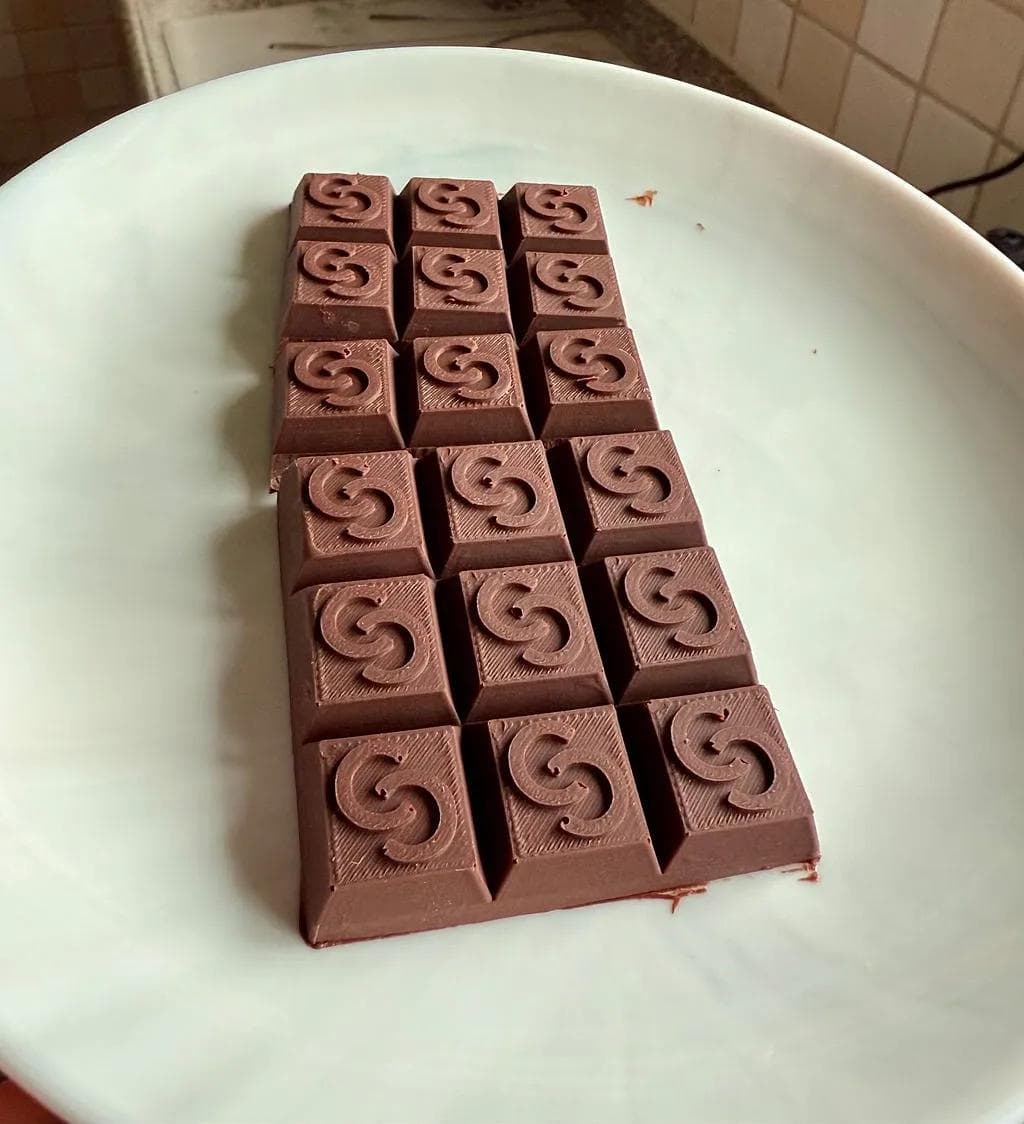 Custom chocolate bars made using a 3D printed mold and silicone casting.